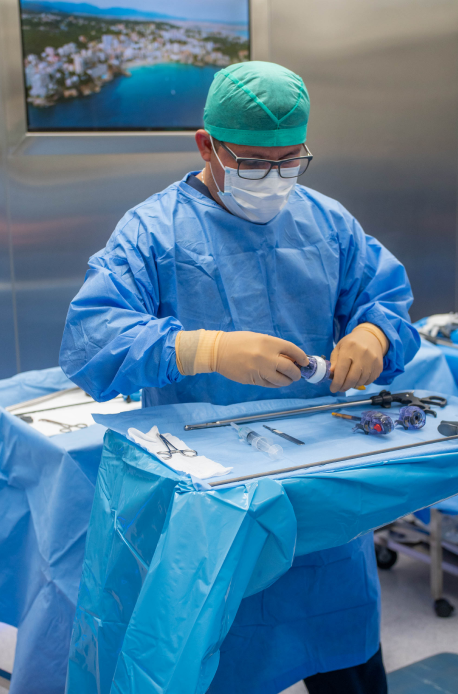 A Surgeon Handling Surgery Equipements