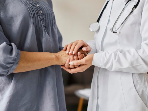 Doctor Holding Patient Hand To Give A Support